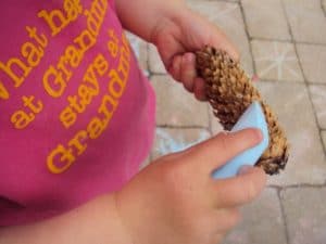 1 of 8 simple outdoor activities for toddlers - chalking on pine cones