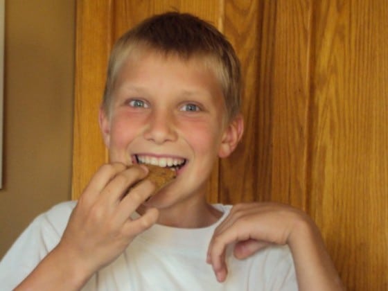 kid eating giant chocolate chip cookie slice