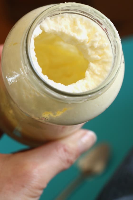 homemade butter thickening in a jar