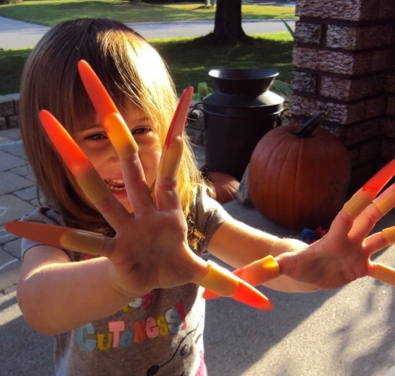 toddler with witch fingernails halloween sensory play