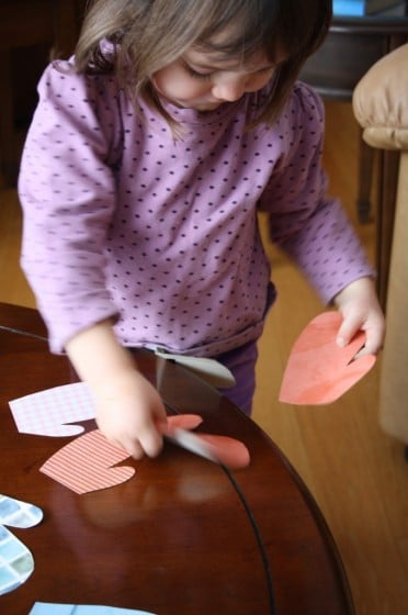 toddler matching up paper mitts