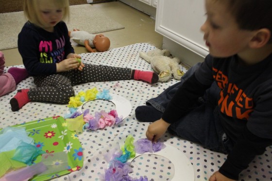 Toddlers working on their Easter wreaths