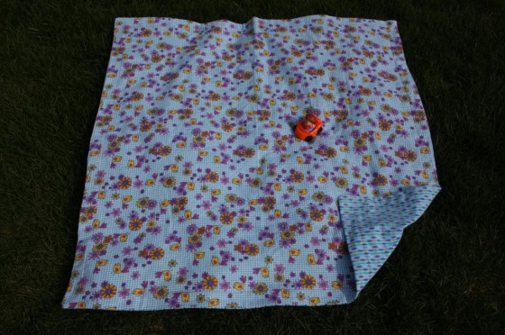extra large, reversible receiving blanket with little people car on it