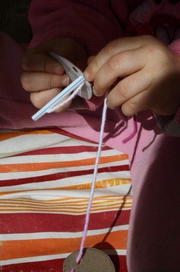 Child's sewing needle made from a drinking straw.