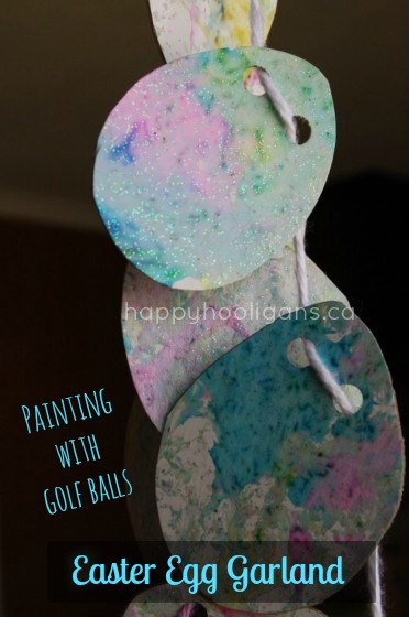 Marbleized Easter craft - an egg garland painted with golf balls.