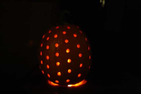 pumpkin with holes drilled into it