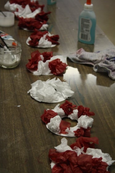 wreaths and glue on craft table