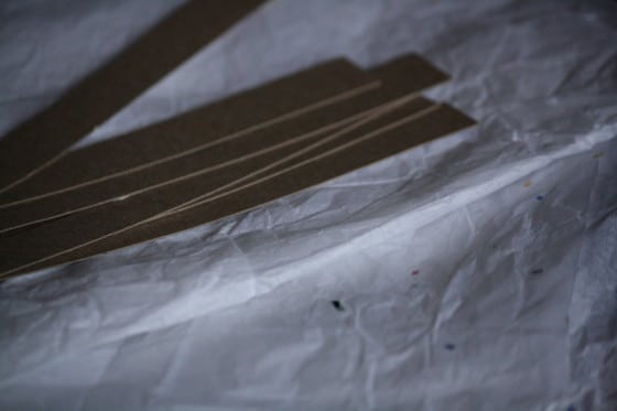 white tissue paper and strips of cardboard