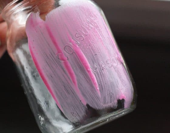 How to paint a mason jar - step one, coat the jar in coloured glue