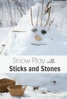 Playing with sticks and stones in the snow