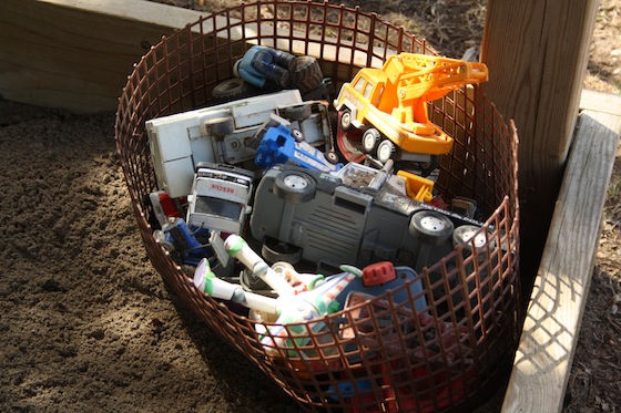 organizing sandbox toys in basket