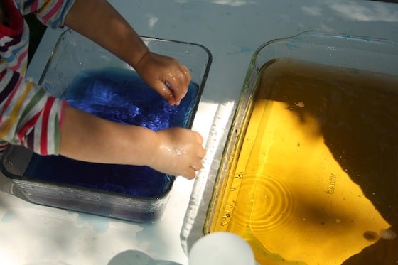 colour mixing activity - 2 pans of coloured water