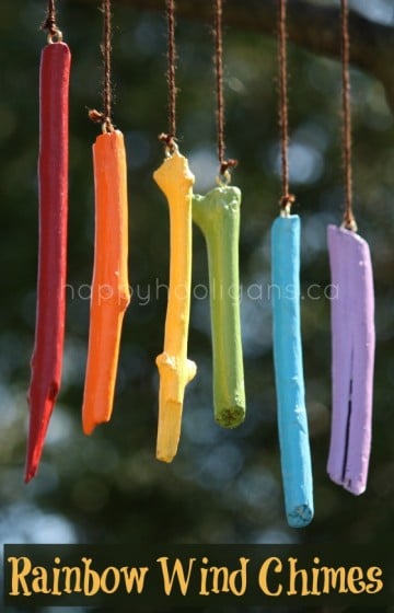 wind chimes made with sticks painted in rainbow colours