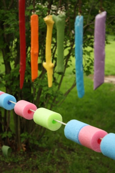 pool noodle abacus set up in backyard for toddlers