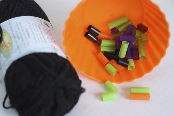 black yarn and coloured straws for hallowe'en necklaces