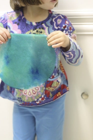 green and blue coffee filter dyed with food colouring