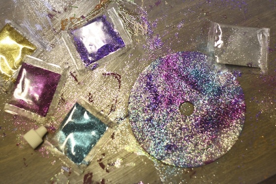 glitter covered cd and table top