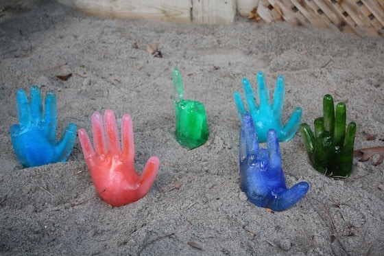 coloured icy hands in sandbox