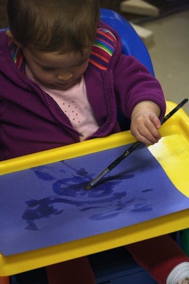 painting with water on construction paper - fine motor art activity for baby