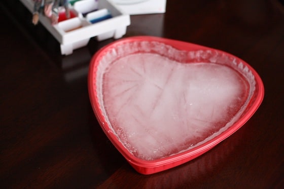 frozen ice in heart-shaped pan for ice painting activity