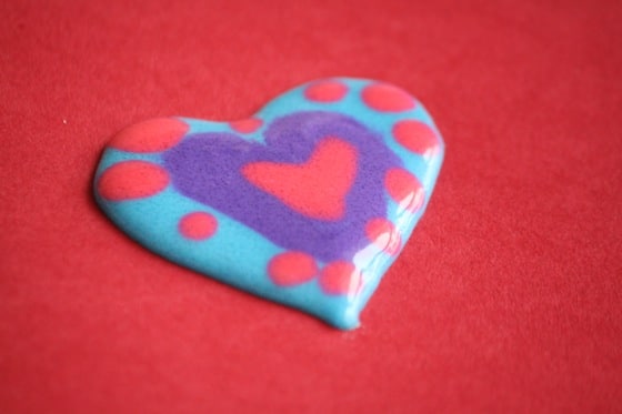 Heart made by layering colours of homemade puffy paint 