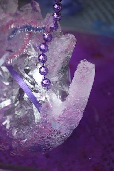 ice hand with treasures frozen in it