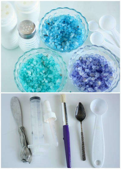 blue, green and purple coloured salt, small scoops, spoons and syringes