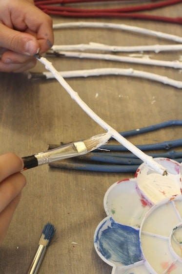 painting white twigs for stars