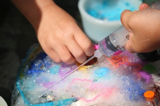 Simple water play activity for kids to excavate toys out of ice with water, salt and small tools