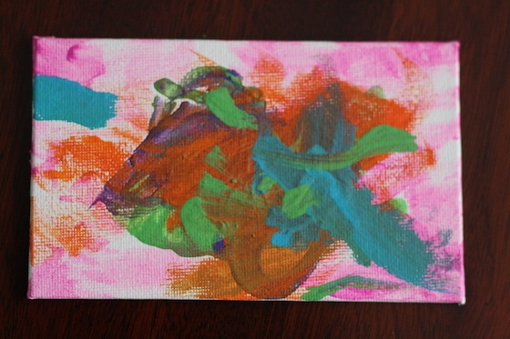 small magnet painted in pink, orange and blue