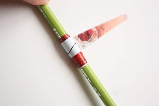 rolling a paper bead with a pencil