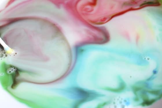 swirls of food colour in milk making science come alive