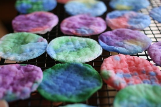 dyed cotton pads drying on cookie rack