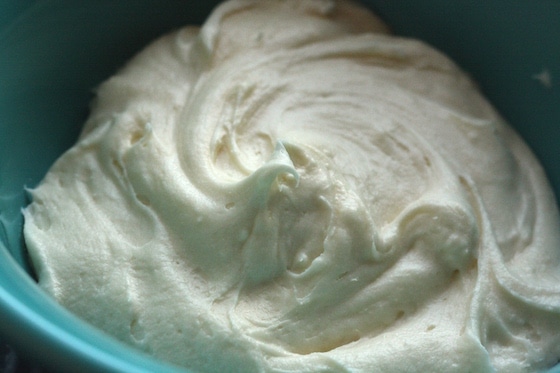 cream cheese icing in blue bowl