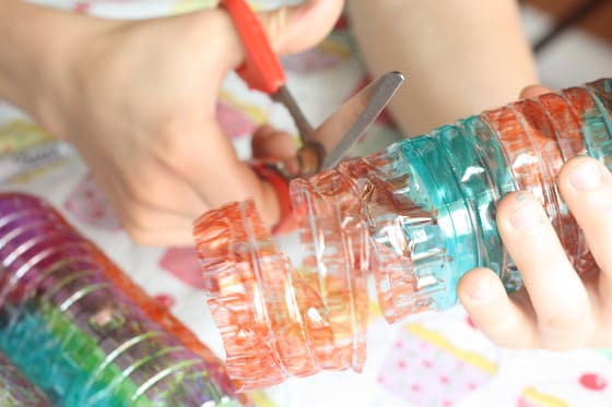 cutting coloured water bottle into spiral