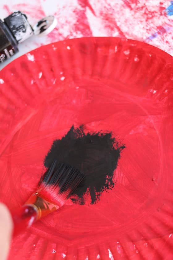 paper plate painted red with black center