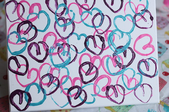 Hearts stamped on canvas with toilet rolls dipped in paint