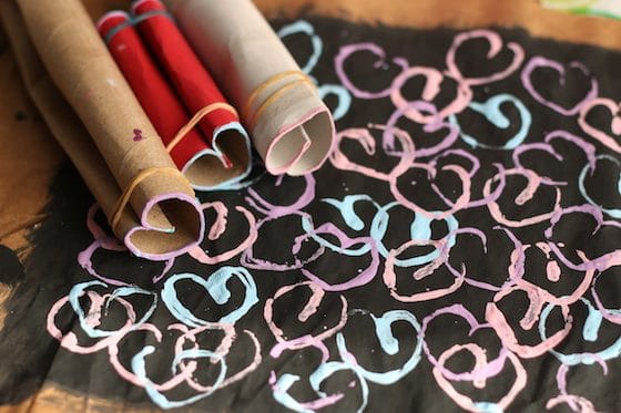 cardboard rolls shaped into hearts and stamped painting