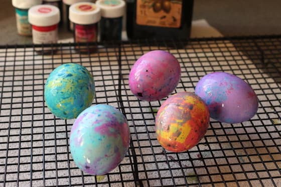 marbled Easter eggs drying on cooling rack 