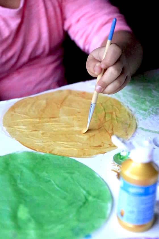 Painting coffee filters with metallic kid's paint
