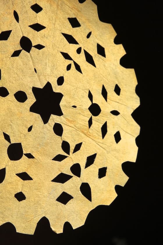 gold snowflake made from a painted coffee filter