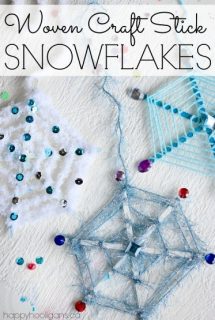3 craft stick snowflake ornaments decorated with yarn and craft jewels