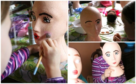Painting faces on styrofoam heads