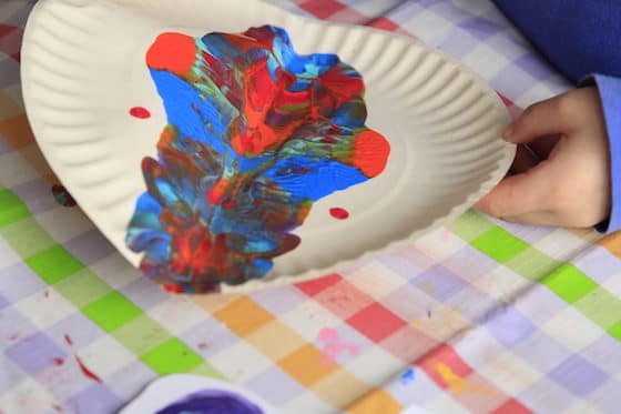 child making butterlies with rorschach painting process