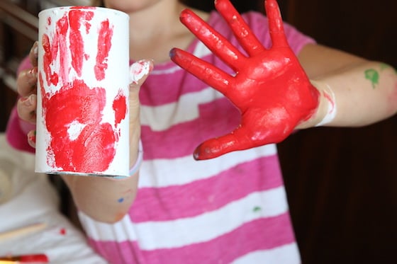 Red hand print on white can