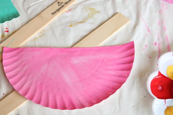 half paper plate painted pink