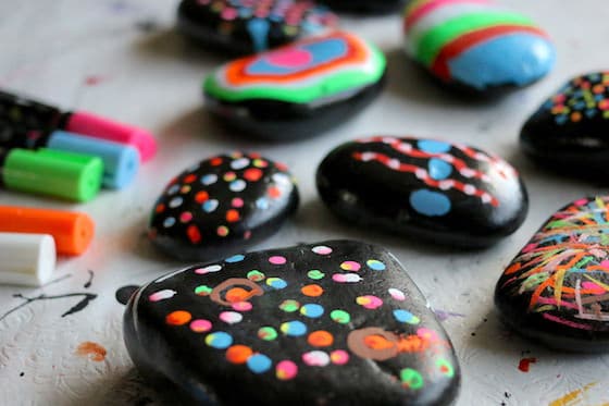 Chalk Rocks - Paperweights made out of black beach stones decorated with liquid chalk markers