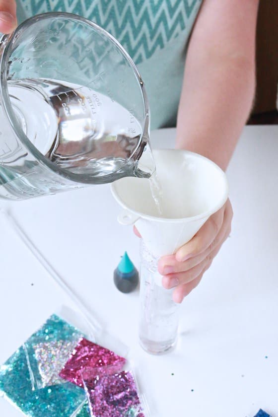 pouring water ininto glitter jar
