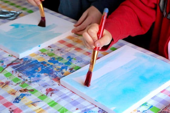 Kids painting canvas blue watercolours