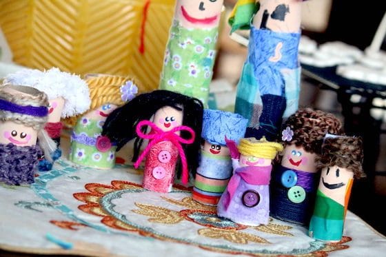 paper towel dolls wrapped in fabric and yarn